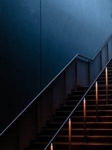 black stairs with gold railings