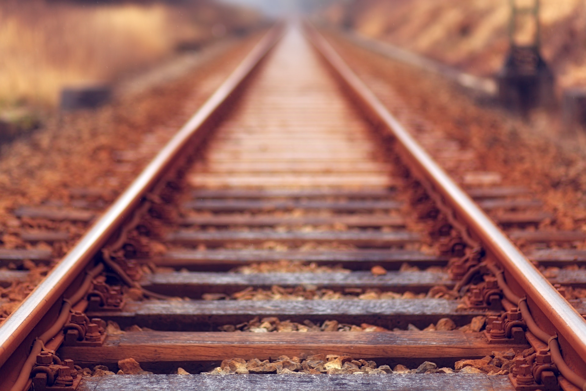 a set of railroad tracks focused on the nearest tracks to the viewer to show we should focus on the positive
